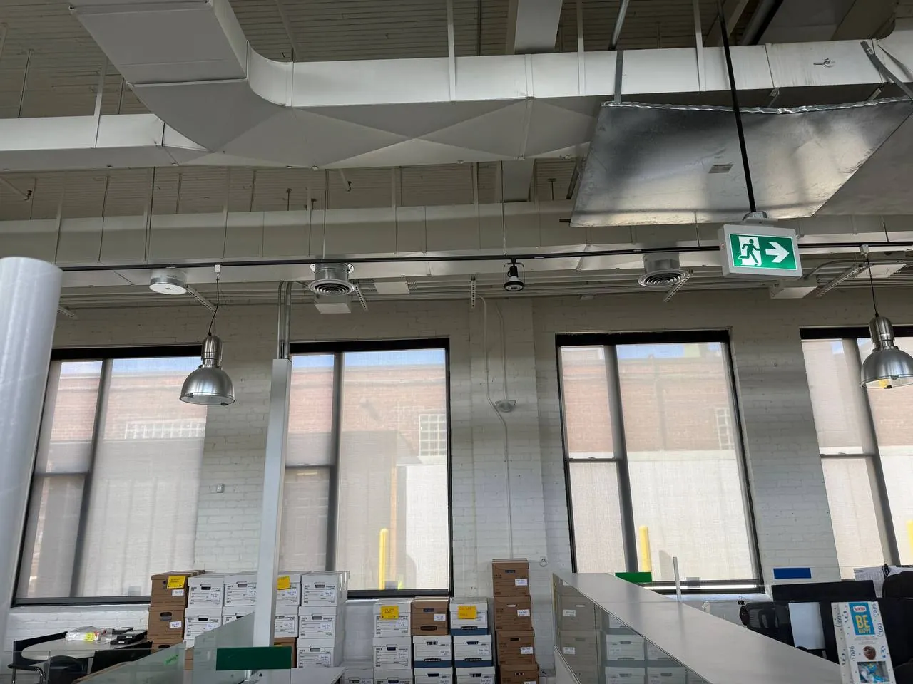 Office ceiling with new ductwork and square ceiling diffusers