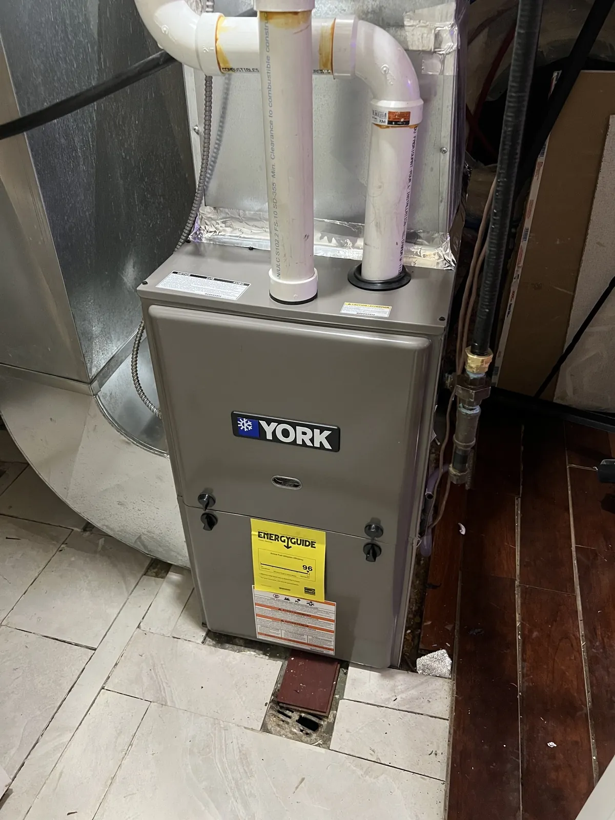 New York gas furnace with tidy PVC venting in a finished basement