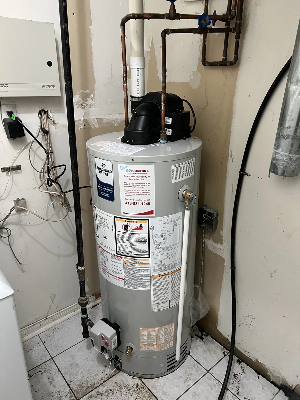 Gas hot water tank with the flue and the water lines connected