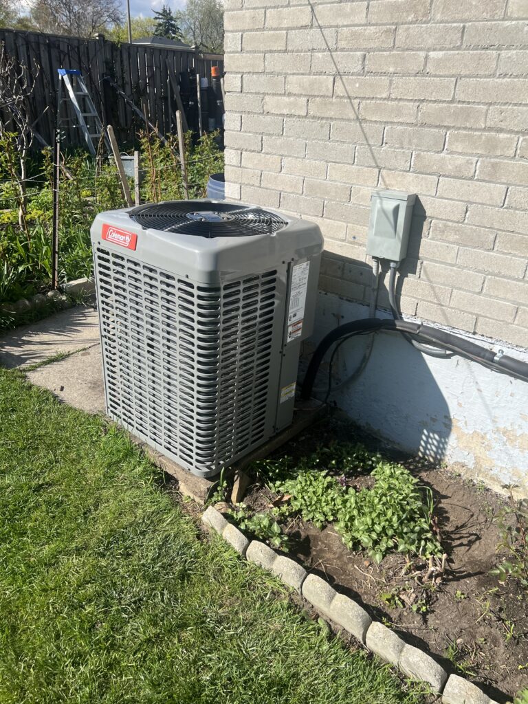 Coleman central air conditioner on leveled pad with electrical disconnect — Mississauga home