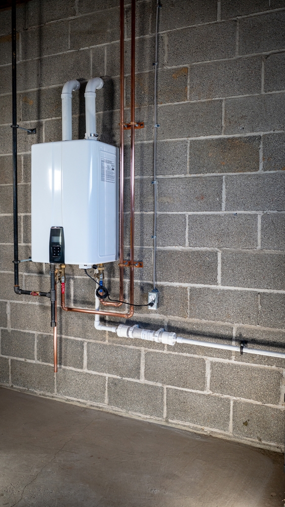 Tankless water heater installed on a basement wall in a Mississauga home