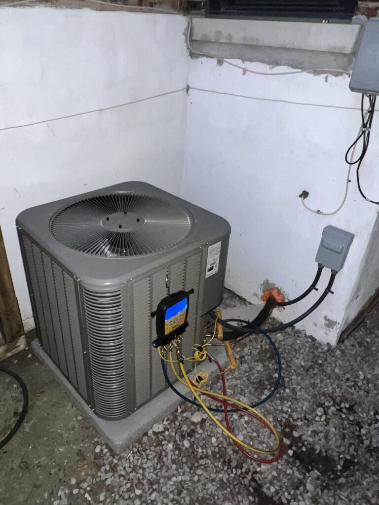 Air conditioning condenser with diagnostic tools connected for inspection