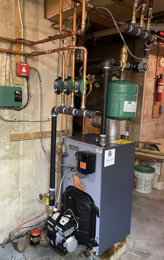 Basement boiler with multiple circulation pumps for zoned heating