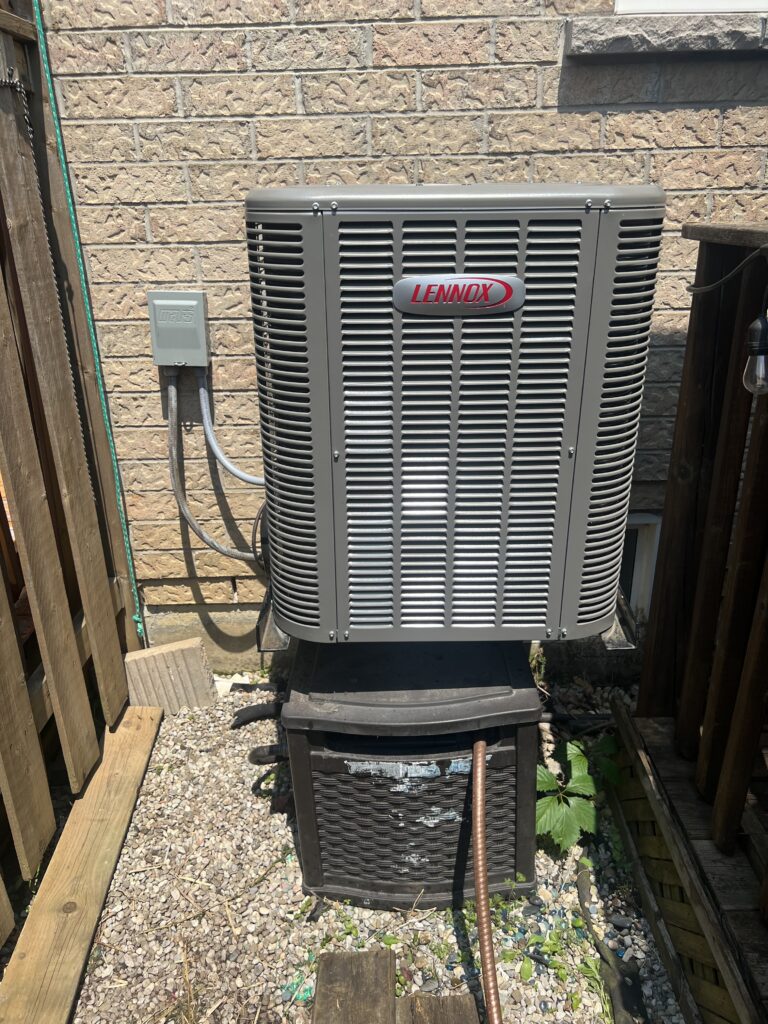 Lennox central air conditioner outdoor condenser installed — Mississauga home