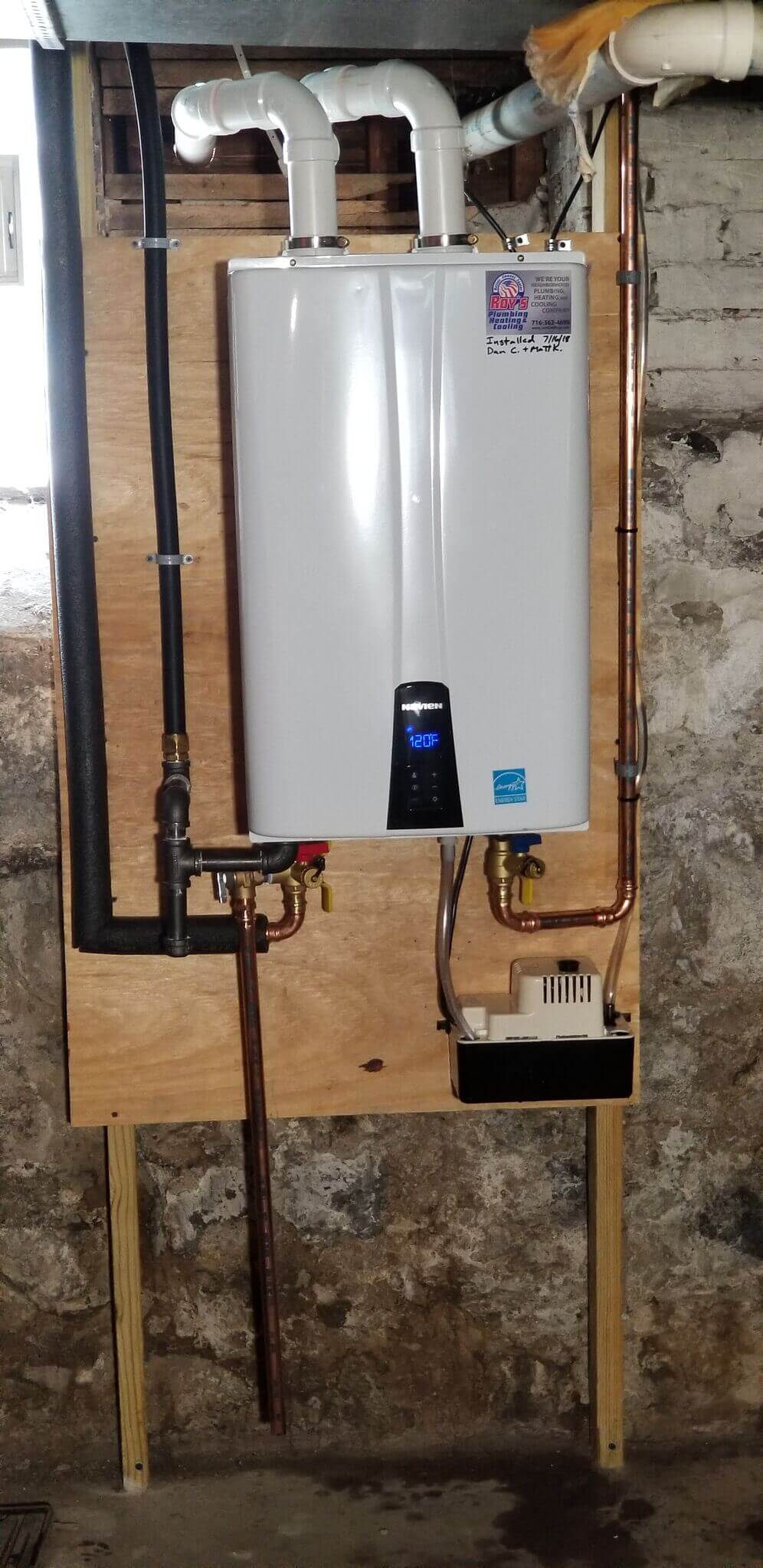 Tankless water heater installed in a Toronto home with wall-mounted unit and venting